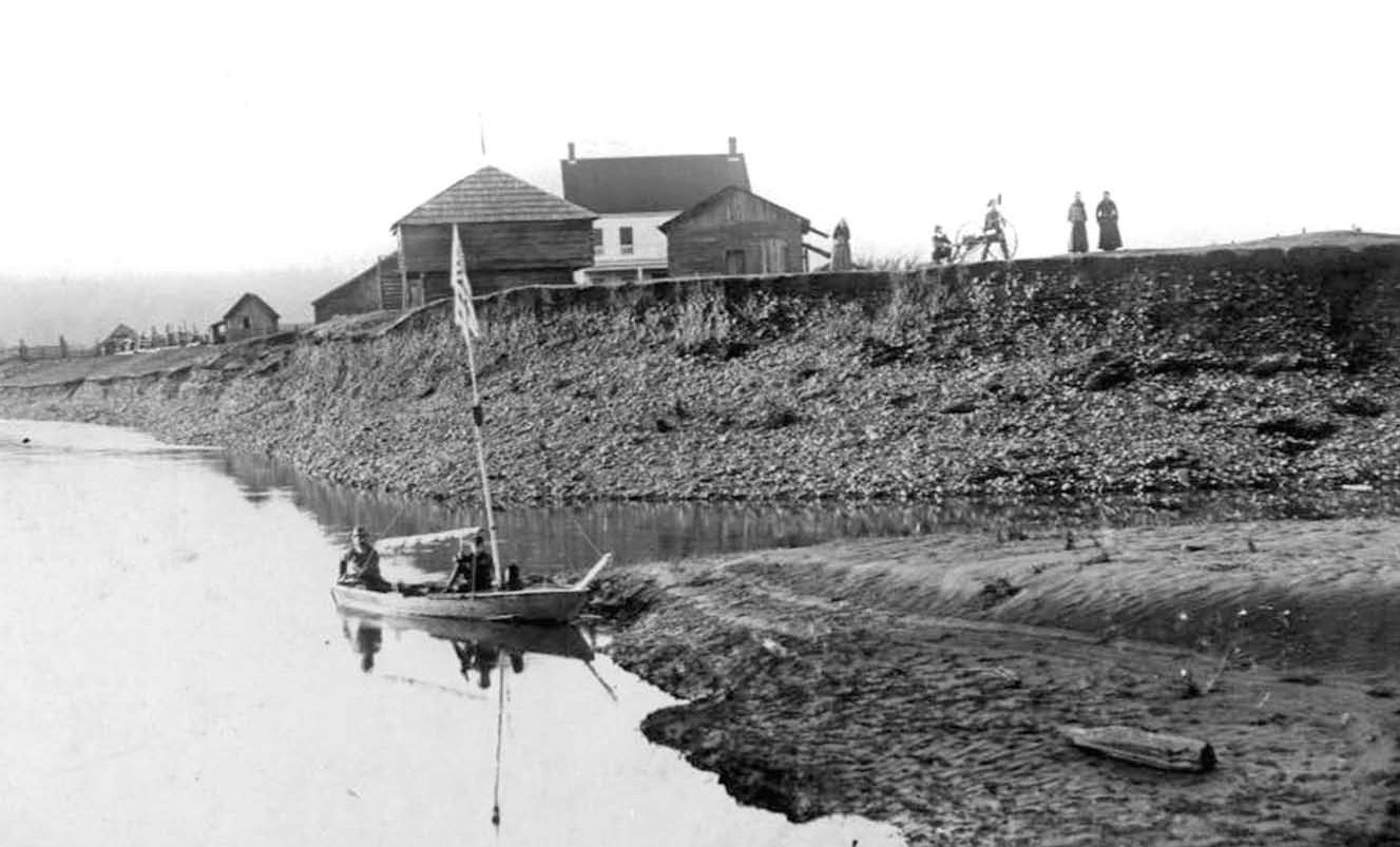 Photo shows the erosion of the Skookumchuck river bank that prompted the eventual removal of the blockhouse to Riverside Park.